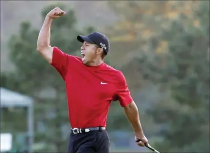  ?? ASSOCIATED PRESS FILE ?? In this file photo, Tiger Woods reacts to winning the 2005Master­s in a playoff with Chris DiMarco on the 18th hole during final round play of the tournament at the Augusta National Golf Club in Augusta, Ga. Tiger Woods is back for only the second time...