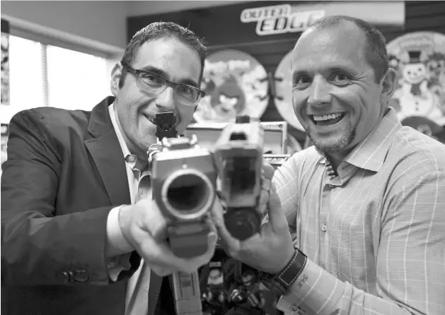  ?? J.P. MOCzULSKI FOR NATIONAL POST ?? Harold Chizick, left, and Tech 4 Kids president Brad Pedersen display their newest toy, TEK RECON, at the company’s head office in Mississaug­a, Ont.