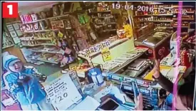  ??  ?? RAID Two men enter Dunbar’s General Stores. One is armed with what looks like a shotgun – and points it at shop assistant Jennifer Zain 1