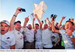  ?? STEPHEN McCARTHY/SPORTSFILE ?? Kildare’s David Hyland celebrates with supporters in Newbridge last week