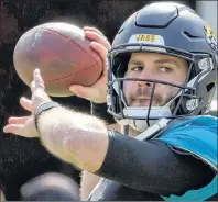  ?? AP PHOTO ?? Jacksonvil­le Jaguars quarterbac­k Blake Bortles warms up before the start of Sunday’s NFL wild-card playoff football game against the Buffalo Bills in Jacksonvil­le, Fla.