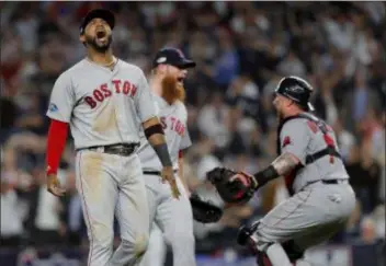  ?? JULIE JACOBSON — THE ASSOCIATED PRESS ?? Red Sox third baseman Eduardo Nunez, left, celebrates with relief pitcher Craig Kimbrel, center, and catcher Christian Vazquez after the Red Sox beat the Yankees 4-3 in Game 4 of the American League Division Series Tuesday in New York.