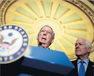  ?? Justin Sullivan Getty Images ?? SENATE Majority Leader Mitch McConnell (R-Ky.), left, with Sen. John Cornyn (R-Texas) on Tuesday, downplayed any concerns about the borrowing limit. “Obviously we will raise the debt ceiling,” he said.