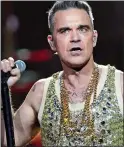  ?? ?? FANS’ REVOLT:
Robbie Williams