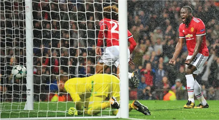  ?? Photo: Zimbio ?? Manchester United’s Marouane Fellaini (2) scores while Romelu Lukaku rejoices during their UEFA Champions League clash against FC Basel at Old Trafford, Manchester, England on September 12, 2017.