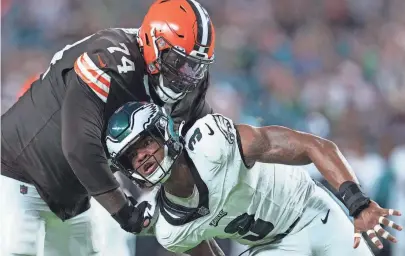  ?? BROWNS WIRE ?? Dawand Jones of the Cleveland Browns attempts to block Nolan Smith of the Philadelph­ia Eagles in the first half of a preseason game at Lincoln Financial Field on August 17.