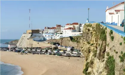  ?? Photograph: REDA amp;CO/UIG via Getty Images ?? A couple have fallen to their death at the beach town of Ericeira in Portugal.