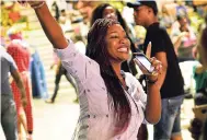  ?? PHOTO BY ANTHONY MINOTT ?? A patron having fun at the recently held Internatio­nal Women’s Day Concert at the National Indoor Sports Centre. Adam Davis of the US-based Skyline Artists Agency says social media is an important channel through which patrons are attracted to...