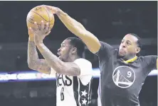  ?? Marcio Jose Sanchez / Associated Press ?? Andre Iguodala remains a top-level defender; just ask the Nets’ Sean Kilpatrick, who never saw this block coming.