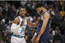  ?? AARON ONTIVEROZ — THE DENVER POST ?? The Nuggets’ Jamal Murray, right, jokes with the Hornets’ Ish Smith at Ball Arena in Denver on Monday.