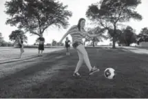  ?? Andy Cross, Denver Post file ?? Foot golfer Amber Arcand hits a fairway shot at the Park Hill Golf Club in 2014.