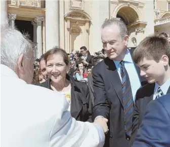 ?? AP PHOTOS ?? NEW CHAPTER: After 20 years with the network, Bill O’Reilly, at left shaking hands yesterday at the Vatican with Pope Francis, was fired by Fox News yesterday amid sexual harassment allegation­s. Tucker Carlson, upper left, will fill his prime-time seat.