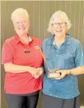  ?? ?? Nine hole ladies captain Carol Fleet presents the Val Dillon Trophy to Ros Robson.