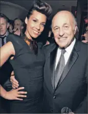  ?? Lester Cohen
Wireimage ?? DOUG MORRIS, with singer Alicia Keys in February, says, “Google is charging us a lot of money … and we would like them to reduce their fees.”