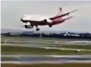  ??  ?? Buffeted: The plane comes in to land