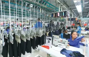  ?? PROVIDED TO CHINA DAILY ?? Workshop of Red Collar, a brand owned by Qingdao Kutesmart, has been transforme­d from a traditiona­l garment factory into a high-tech unit capable of making customized products.