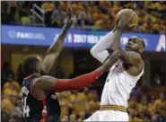  ?? TONY DEJAK — THE ASSOCIATED PRESS ?? LeBron James drives against the Raptors’ Patrick Patterson during the playoffs last season.