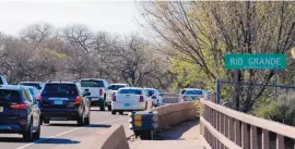  ?? JIM THOMPSON/ JOURNAL ?? Drivers cross the river bridge at Alameda. Five crossings over the Rio Grande are the top five most congested traffic roadways in the entire metro area, according to the latest Mid-Region Metropolit­an Planning Organizati­on rankings.