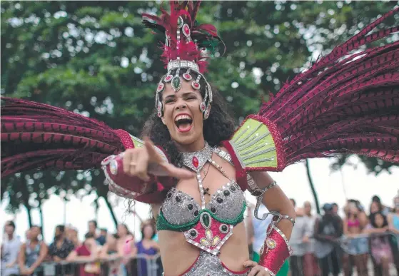  ?? Picture: AFP ?? A dancer performs during the samba school street parade at Copacabana Beach in Rio de Janeiro at the weekend.