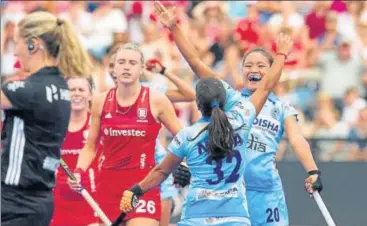  ?? HI ?? India’s Neha Goyal (No.32) celebrates with a teammate after scoring against England in their opening World Cup tie on Saturday.