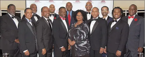  ??  ?? Honorees (front row) Darren Peters; Darrin Williams; Pyramid Award recipient Dexter Doyne; corporate sponsor award winner Teresa Conner; Scott Hamilton; Jonathan Evans; and (back row), Austin Porter Jr.; Darius Nelson; Reginald M. Johnson; Sidney Moncrief; Timothy Pruitt Jr.; James Rodgers Jr.; and Orville E. Abrams Jr.