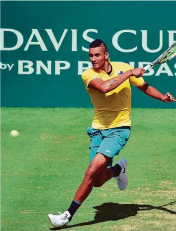  ?? AFP ?? Australia’s Nick Kyrgios hits a return against Slovakia’s Andrej Martin during the Davis Cup World Group play-off in Sydney yesterday.