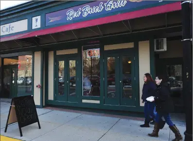  ?? Ernest A. Brown photo ?? Customers leave the Red Brick Grill after lunch on Friday. The restaurant opened this week, and is located at 83 Main St. in Woonsocket.