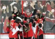  ?? ADRIAN WYLD — THE CANADIAN PRESS VIA AP ?? Ottawa Senators center Jean-Gabriel Pageau (44) celebrates his third goal of the game against the New York Rangers with teammates during the third period of Game 2 of an NHL hockey Stanley Cup second-round playoff series Saturday, April 29 2017, in...