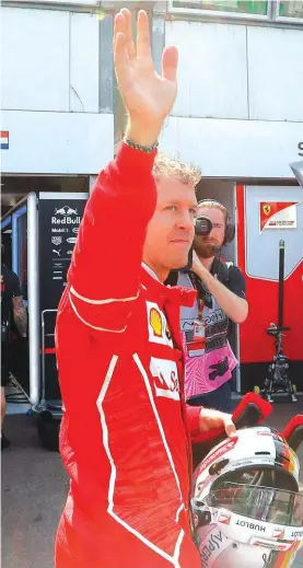  ??  ?? Ferrari driver Sebastian Vettel of Germany waves to the crowd after the second free practice at the Monaco racetrack yesterday Photo: AP