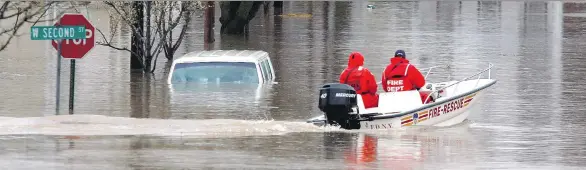  ?? MICHAEL NAGLE/GETTY IMAGES FILES ?? U.S. President Donald Trump issued an executive order to pave the way for the approvals of infrastruc­ture projects, revoking Obama-era standards requiring that builders factor in the risk of increased flooding due to climate change. Trump said the...