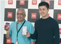  ?? Photo by Alvin R. Cabral ?? Ravi Matthew, general manager at Task, and Donovan Sung, director of product management and marketing at Xiaomi Global, with the new Xiaomi Mi 6 and Mi Max 2 during the opening of the Middle East’s first Authorized Mi store in Dubai. —