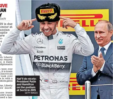  ?? GETTY IMAGES ?? Hat’ll do nicely: President Putin and Hamilton on the podium at Sochi in 2015