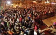  ?? JONATHAN TRESSLER — THE NEWS-HERALD ?? A crowd of thousands on Erie Street in Downtown Willoughby, as seen from the second floor of Fiona’s Coffee Bar & Bakery, awaits the lights Nov. 30 during the city’s 48th annual Holiday Lighting Program.