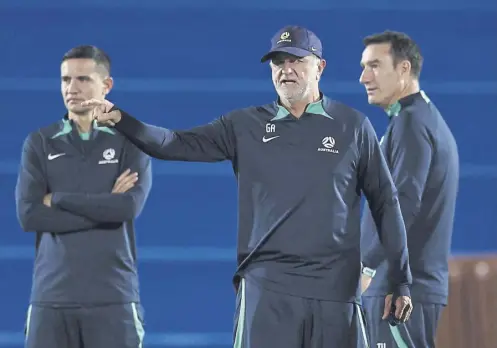  ?? ?? ↑ Australia head coach Graham Arnold points the way during a training session in Qatar