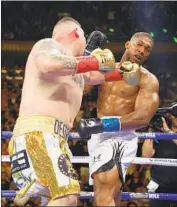  ?? Al Bello Getty Images ?? ANTHONY JOSHUA, right, suffered his first loss against Andy Ruiz Jr. on June 1 in New York.