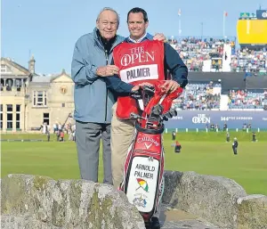  ?? Picture: PA. ?? Arnold Palmer poses for a photo with his caddie on the Swilcan Bridge, St Andrews, during the Champions Challenge last year.