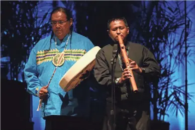  ??  ?? Navajo flutist Jonah Littlesund­ay performs Thursday during the memorial service for U.S. Sen. John McCain at North Phoenix Baptist Church in Phoenix.