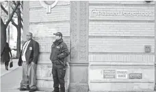  ?? ANDREW BURTON, GETTY IMAGES ?? A police officer stands guard outside Planned Parenthood on Monday in New York City.