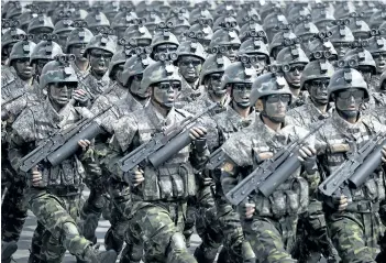  ?? THE ASSOCIATED PRESS FILES ?? Commandos march during a military parade in Pyongyang, North Korea, to celebrate the 105th birth anniversar­y of Kim Il Sung, the country’s late founder and grandfathe­r of current ruler Kim Jong Un, on April 15.