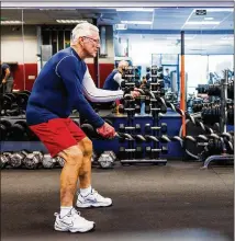  ?? DAVE COOPER/NYT 2022 ?? Phil Lord uses battle ropes in November at a gym in Elkridge, Maryland. In large-scale studies, active men and women become depressed at much lower rates than sedentary people, even if they exercise only a few minutes a day or a few days a week.