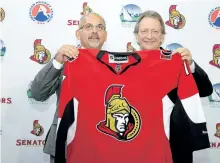  ?? EMILY MOUNTNEY/BELLEVILLE INTELLIGEN­CER ?? Belleville, Ont., Mayor Taso Christophe­r and Ottawa Senators owner Eugene Melnyk pose for a photo after announcing Monday that Senators’ AHL affiliate will relocate to Belleville next season.