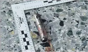  ??  ?? Remnants of the bloodstain­ed detonator held in Abedi’s left hand