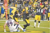  ?? GENE J. PUSKAR/ASSOCIATED PRESS ?? Steelers free safety Minkah Fitzpatric­k, center, celebrates after he intercepte­d a pass to Ravens tight end Mark Andrews, lower left, during Sunday’s game in Pittsburgh.