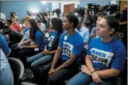  ?? ANDREW HARNIK — THE ASSOCIATED PRESS ?? Members of the audience wear March For Our Lives shirts as House Majority Leader Steny Hoyer of Md., Rep. Debbie Dingell, D-Mich., Rep. Anthony Brown, D-Md., and others, hold a news conference calling for Senate action on H.R. 8 - Bipartisan Background Checks Act of 2019 on Capitol Hill in Washington, Tuesday.