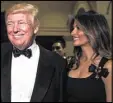  ??  ?? President-elect Donald Trump and his wife, Melania, speak with reporters at his New Year’s Eve party.