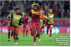  ?? ?? Late drama… Qatar’s Mohammed Muntari celebrates his stoppage-time goal v Algeria