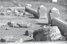  ?? SEAN LOGAN/THE REPUBLIC ?? A headstone stands at one of the graves at Pioneer and Military Memorial Park in Phoenix. In contrast, at the neglected Sotelo-Heard Cemetery in south Phoenix, the few headstones that remained have been removed and stored elsewhere to keep them from being vandalized.