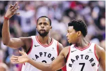  ?? FRANK GUNN/THE CANADIAN PRESS ?? Toronto Raptors forward C.J. Miles, left, and guard Kyle Lowry celebrate a basket against the Washington Wizards during the second half of Saturday’s playoff game in Toronto.