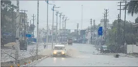  ?? HT PHOTO ?? A waterlogge­d road in Dhanbad on Monday.