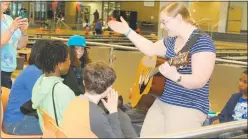  ?? STAFF PHOTO BY JAMIE ANFENSON-COMEAU ?? Music instructor Julia Reppucci leads students in an exploratio­n of music during Charles County Public Schools’ inaugural Autism Awareness Fair, held Saturday at St. Charles High School.